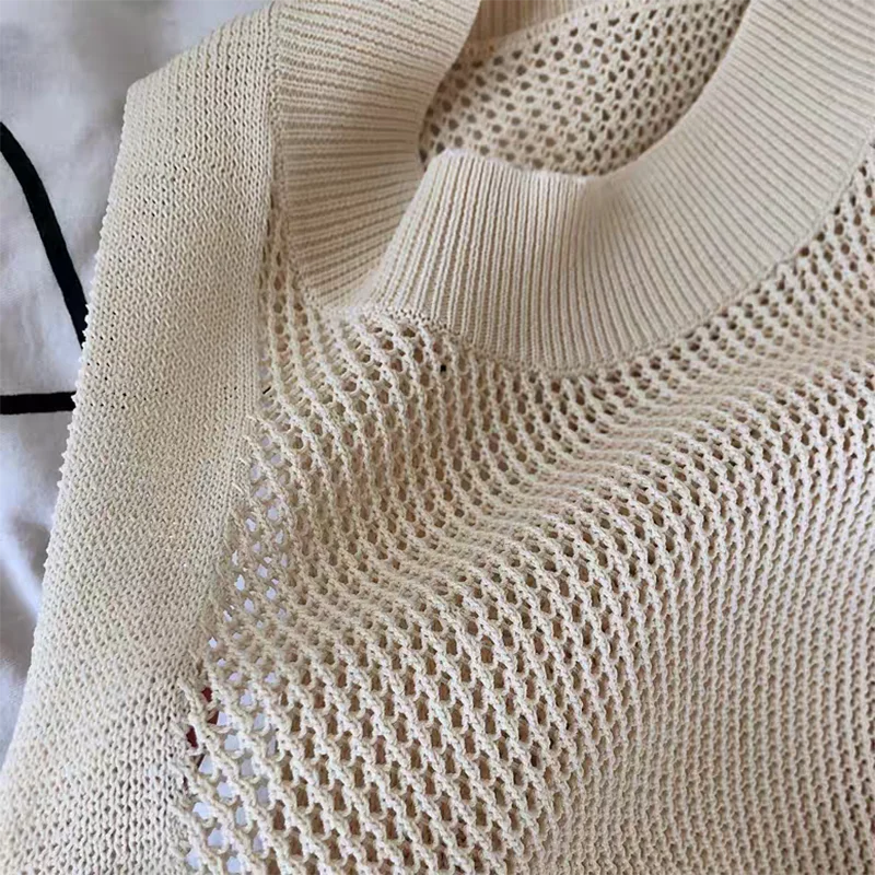 Camiseta sin mangas de punto hueca lisa